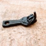 Hand forged steel kering in the shape of a hand giving the middle finger gesture